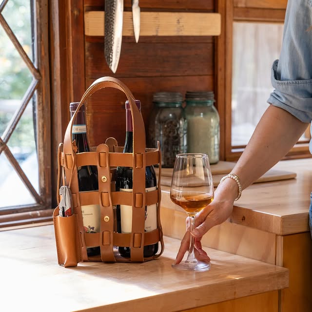 WP Standard leather wine tote placed on a kitchen countertop, showcasing its elegance and durability.