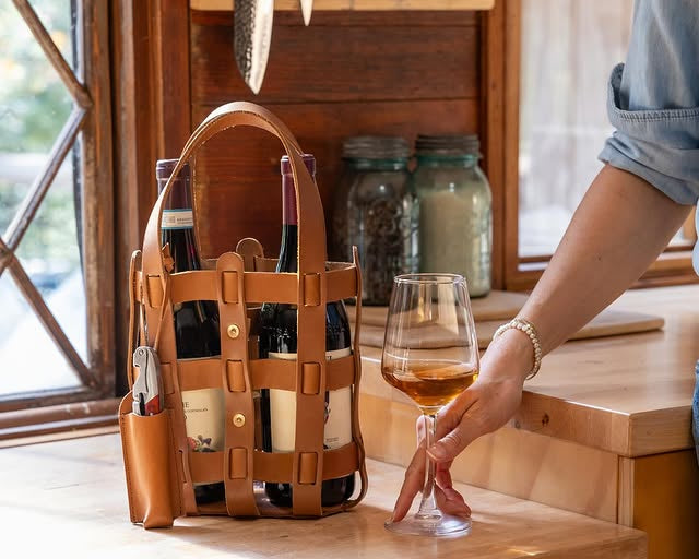 WP Standard leather wine tote placed on a kitchen countertop, showcasing its elegance and durability.