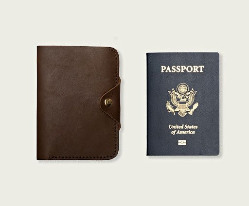 A tan passport wallet from WP Standard and a US passport captured together in a frame. 