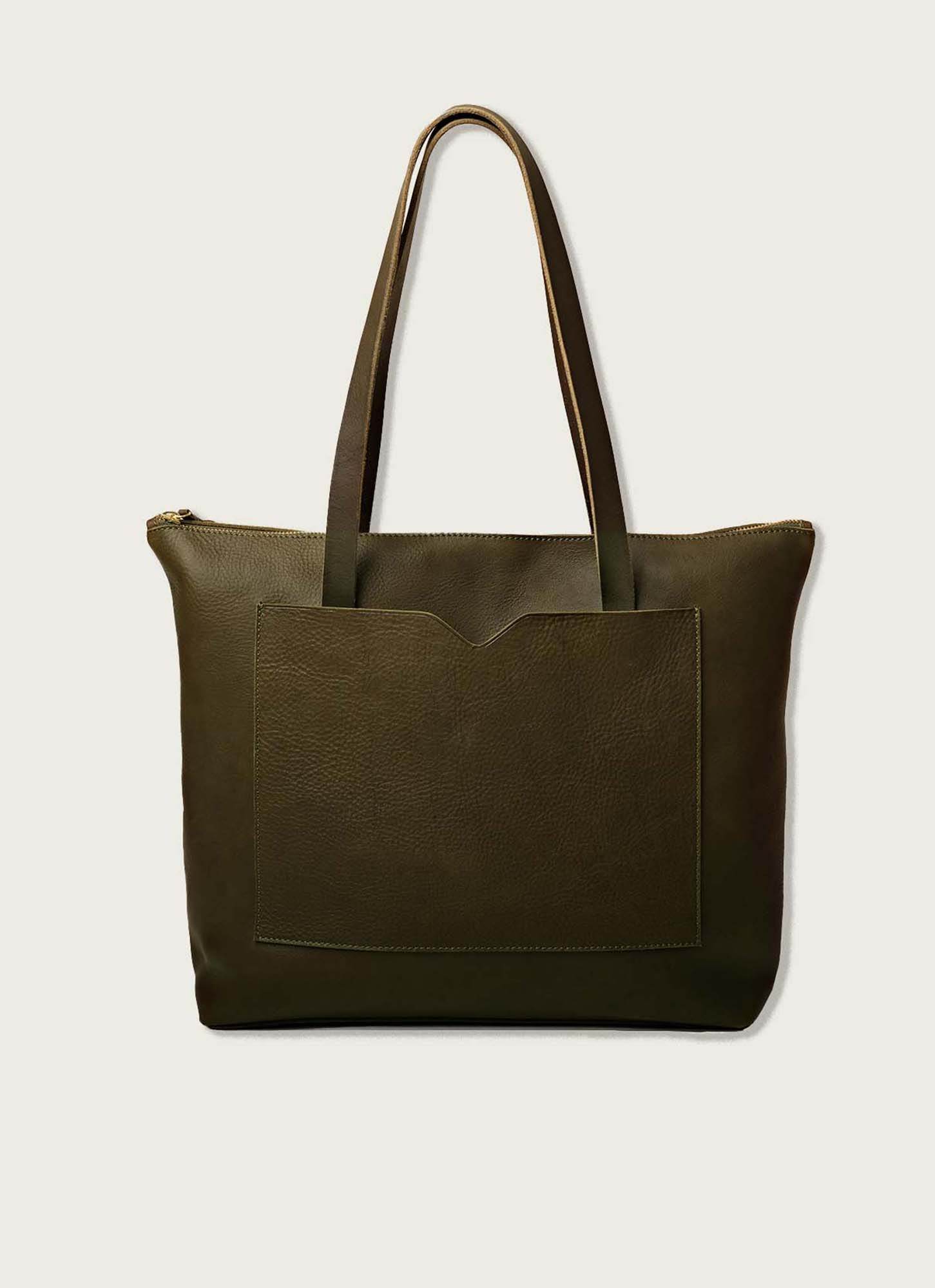 A dark olive full-grain leather tote bag with long handles, a spacious zippered main compartment, and a front pocket, designed for everyday use and effortless style.