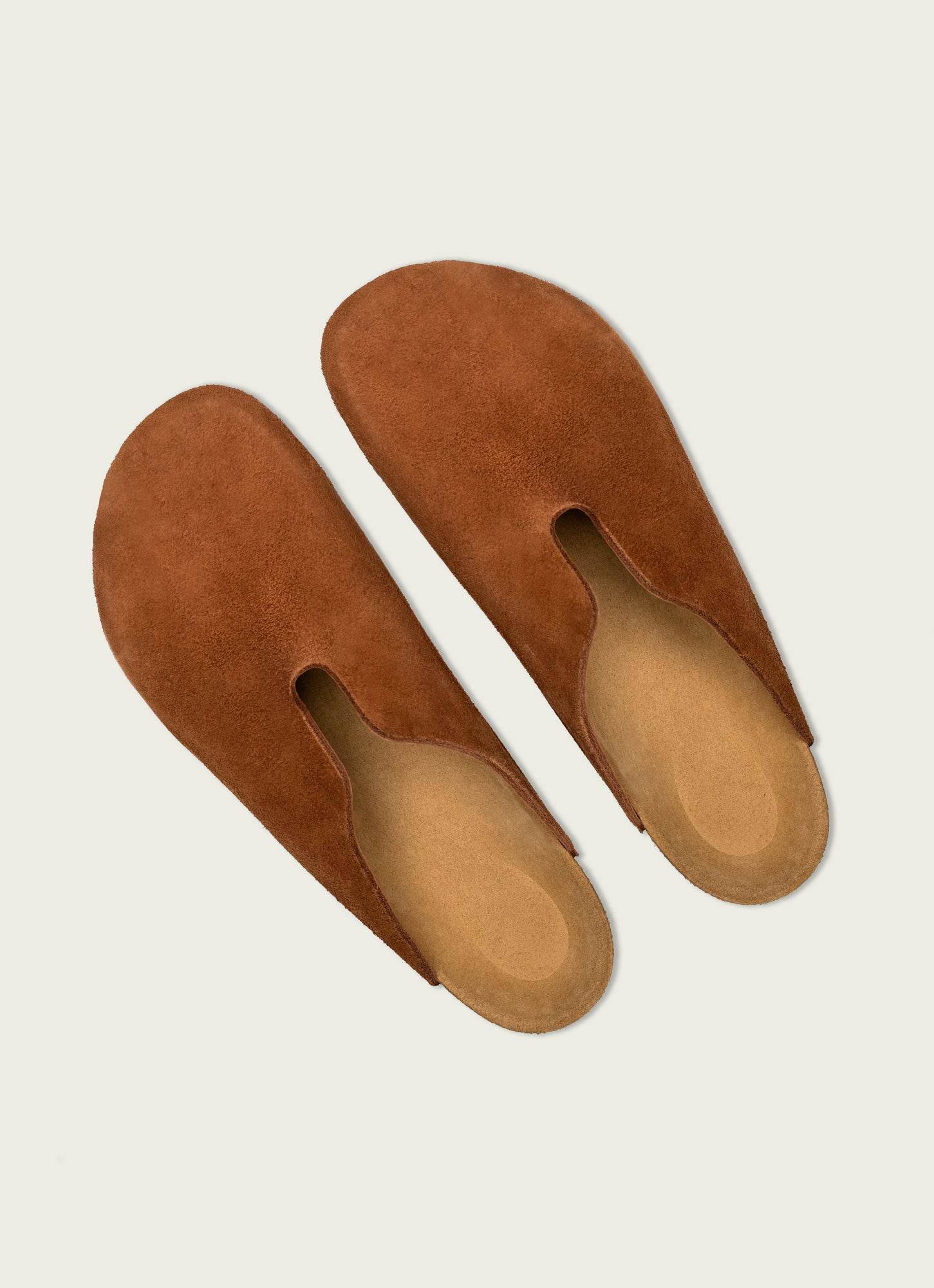 Handcrafted brown suede slip-on slippers with soft cushioned insole – premium unisex footwear for comfort, style, and everyday wear.