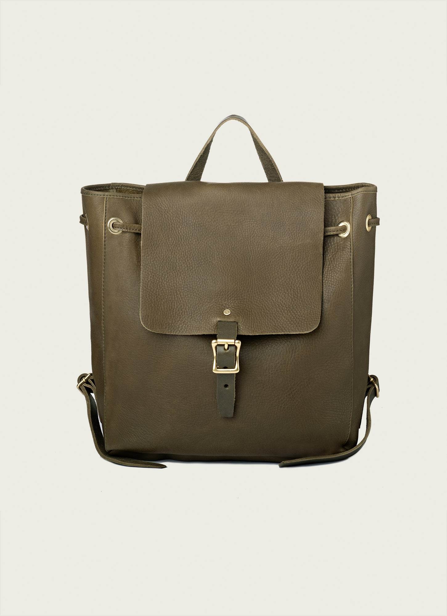 Compact leather backpack with zip pocket and magnetic closure for daily use.