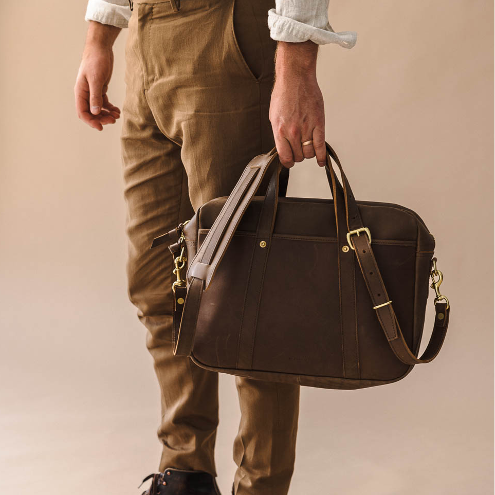 brown leather briefcase with debossed logo