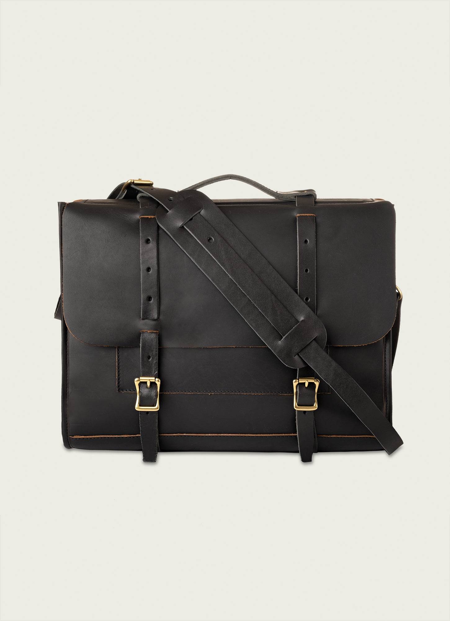 Sleek leather messenger bag with soft finish and dual compartments for work essentials.